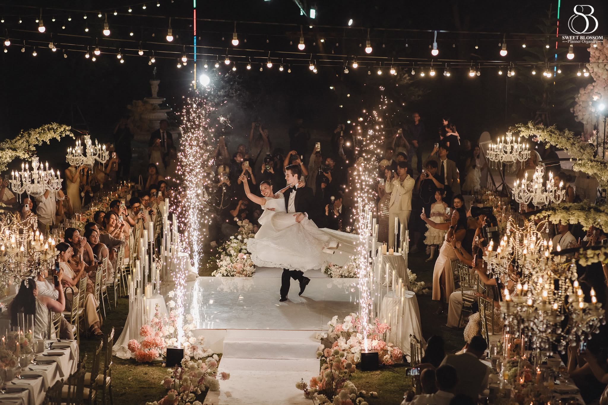 Sweet Blossom Wedding Planner outdoor wedding reception with candlelight and celebration