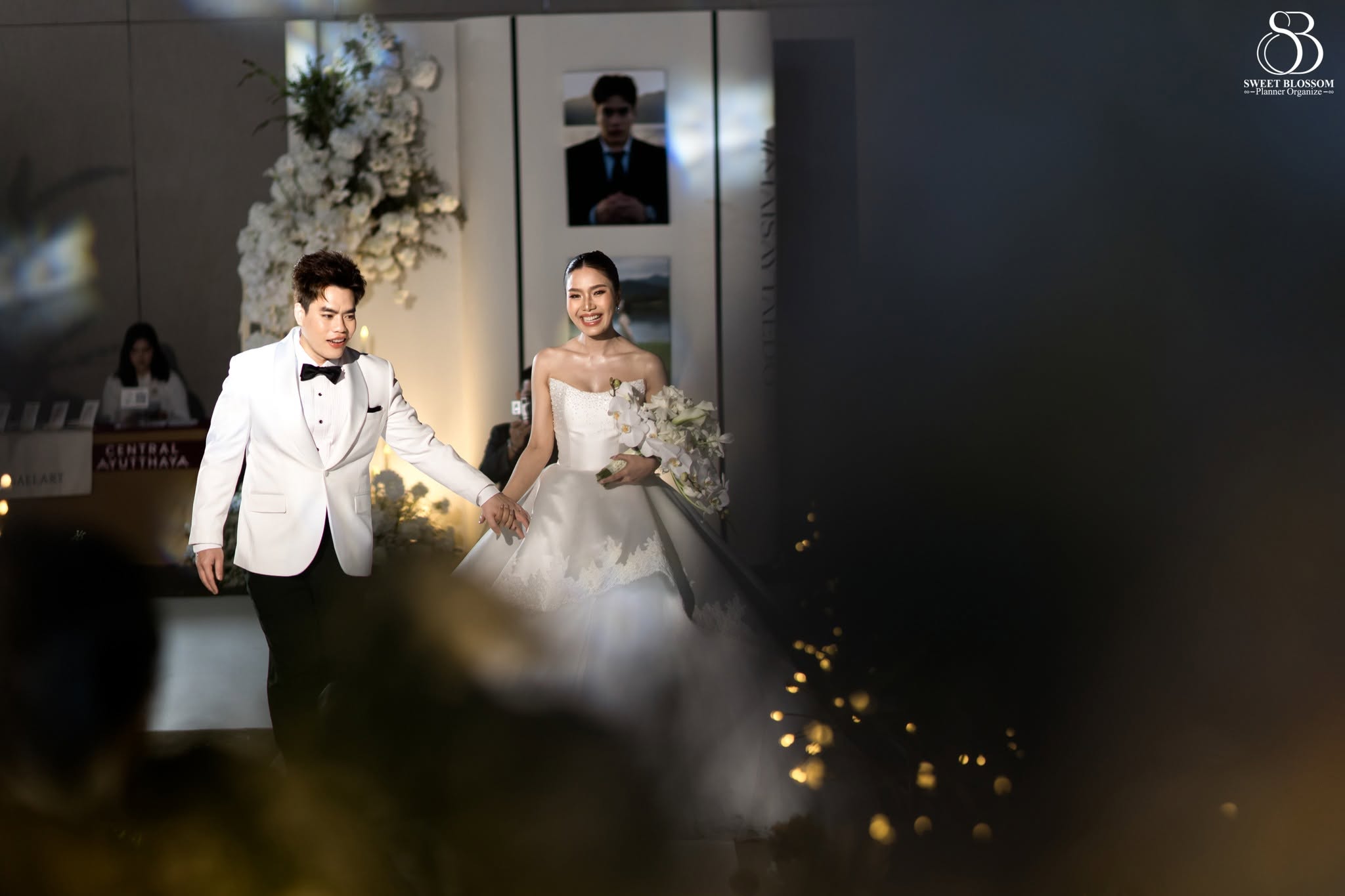 Sweet Blossom Wedding Planner grand wedding entrance with evening lights