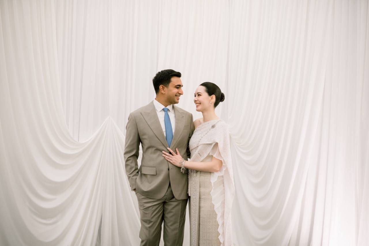 Sweet Blossom Wedding Planner elegant couple portrait with white drapery